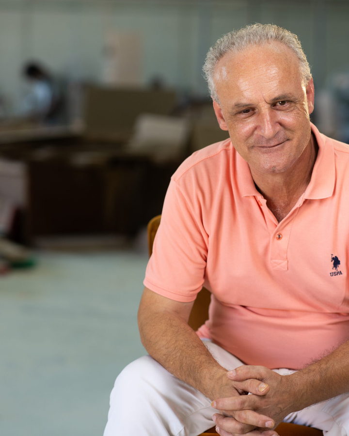 Roberto Pascalli, founder and master furniture maker at FlorenStyle, seated in the company workshop in Dubai
